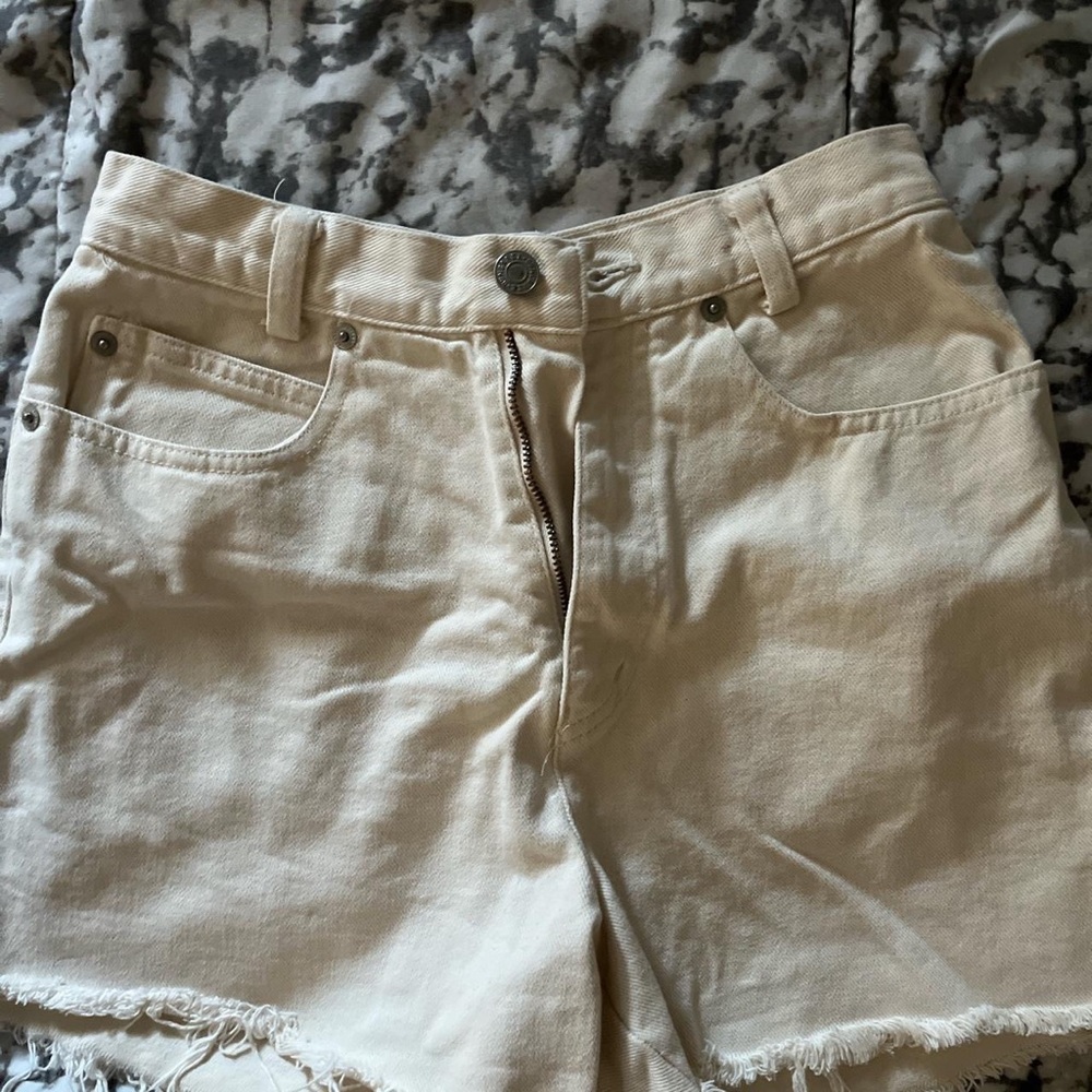 Cream distressed shorts
